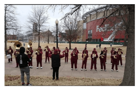 Oakhaven HS Band prepping for a performance outside the FedEx Forum